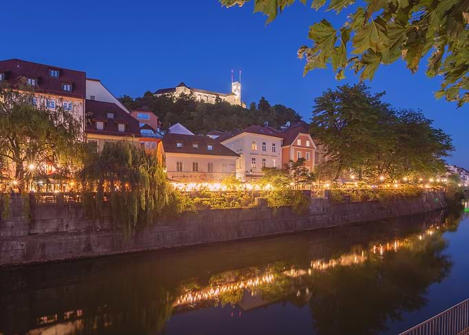 Ljubljana Castle Overlooking River at Night