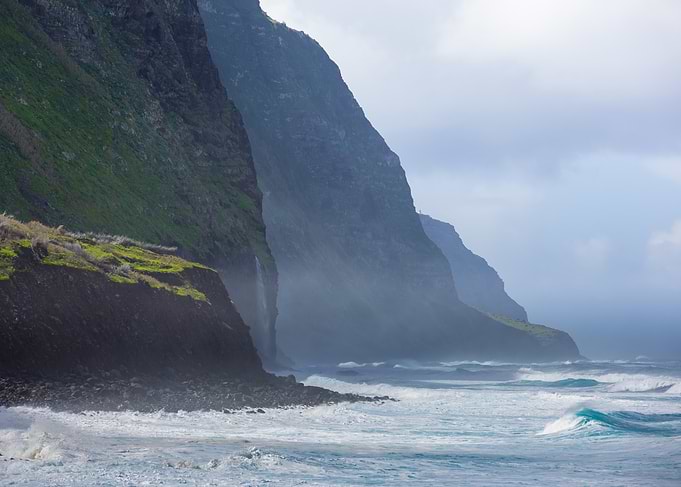Misty Coastal Cliffs and Ocean Waves