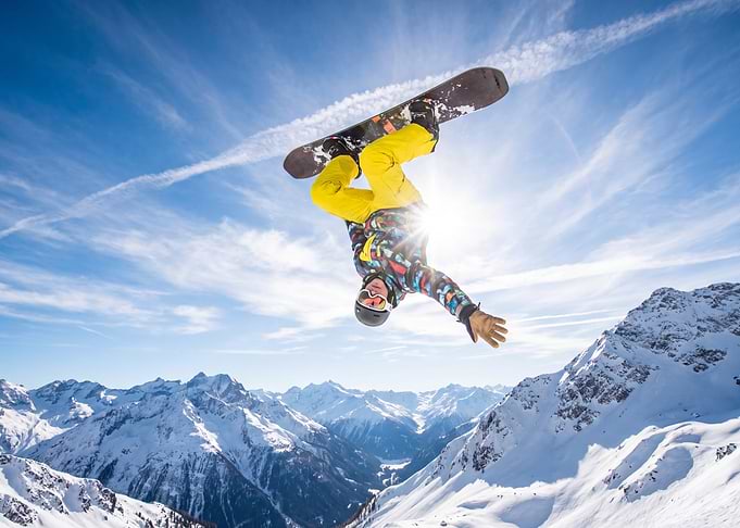 Snowboarder performing an aerial trick
