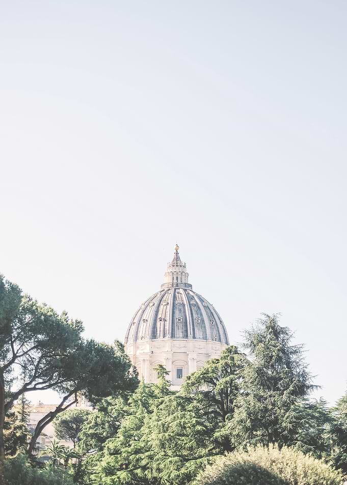 Rome, Italy | Vatican St. Peter's Basilica dome above garden trees nature in a pastel hued urban landscape