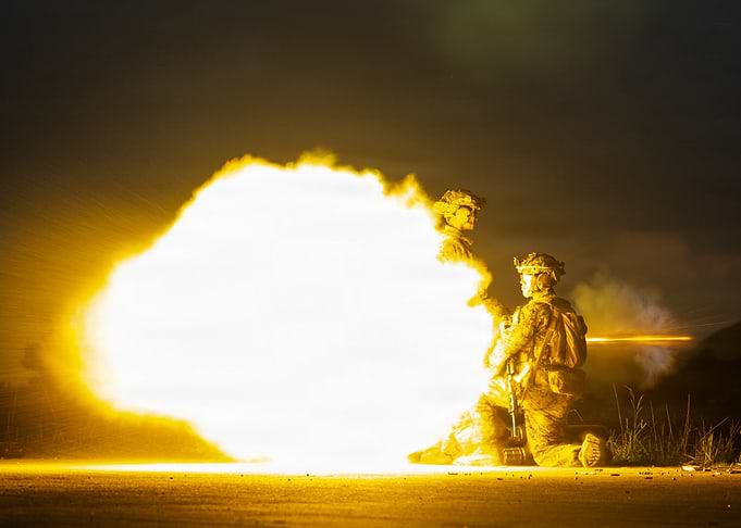 Soldiers Firing Weapon at Night