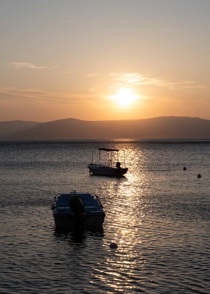 Boats at Sunset on Calm Water