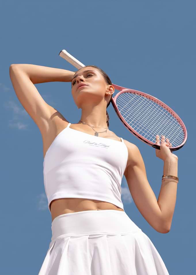 Woman in White Tennis Outfit