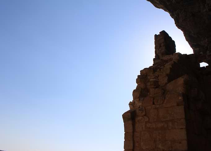 Ancient Stone Ruins Against Blue Sky