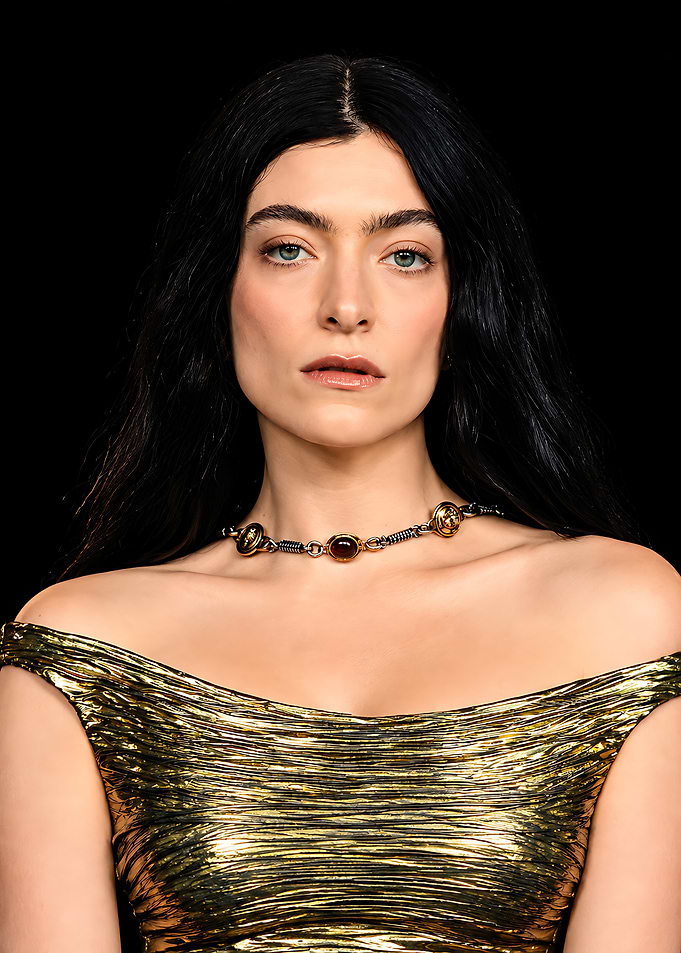 Lorde in Metallic Gold Dress