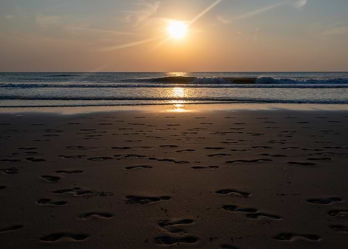 Footprints on Beach at Sunset
