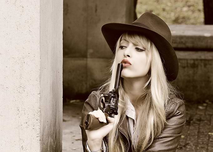Blonde Woman Holding Vintage Revolver
