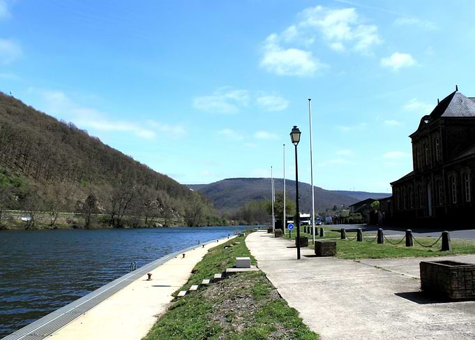 Scenic Riverbank Path and Historic Building