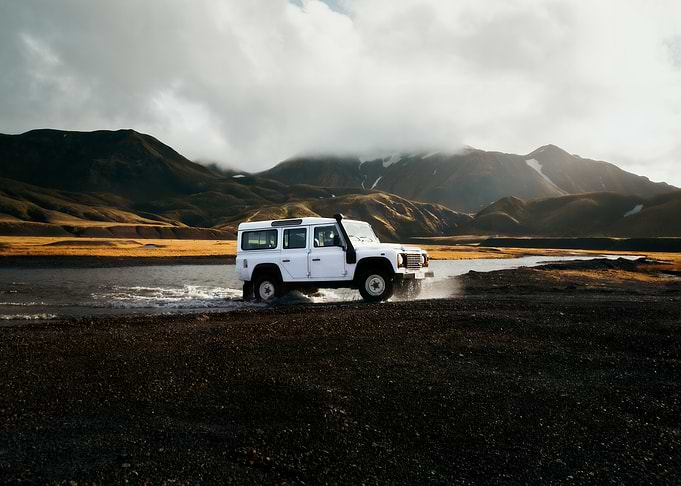 White Land Rover Defender Off-Roading
