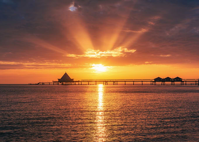 Golden Sunrise Over Pier on the Baltic Sea