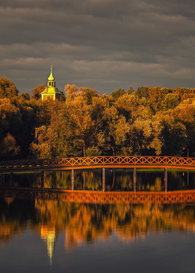 Golden Autumn Bridge and Church Reflection