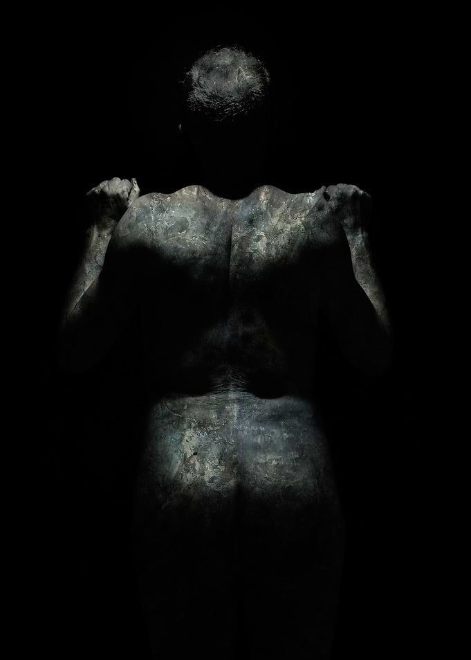 Ethereal Human Figure in Darkness