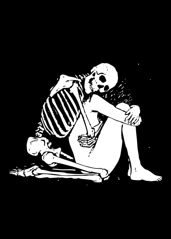 Skeleton Embracing Human Figure