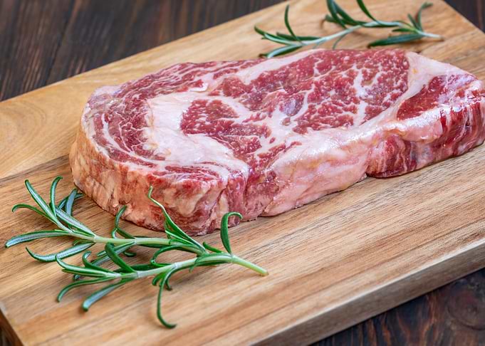 Raw Ribeye Steak with Rosemary