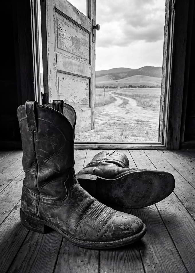 Worn Cowboy Boots in Open Doorway