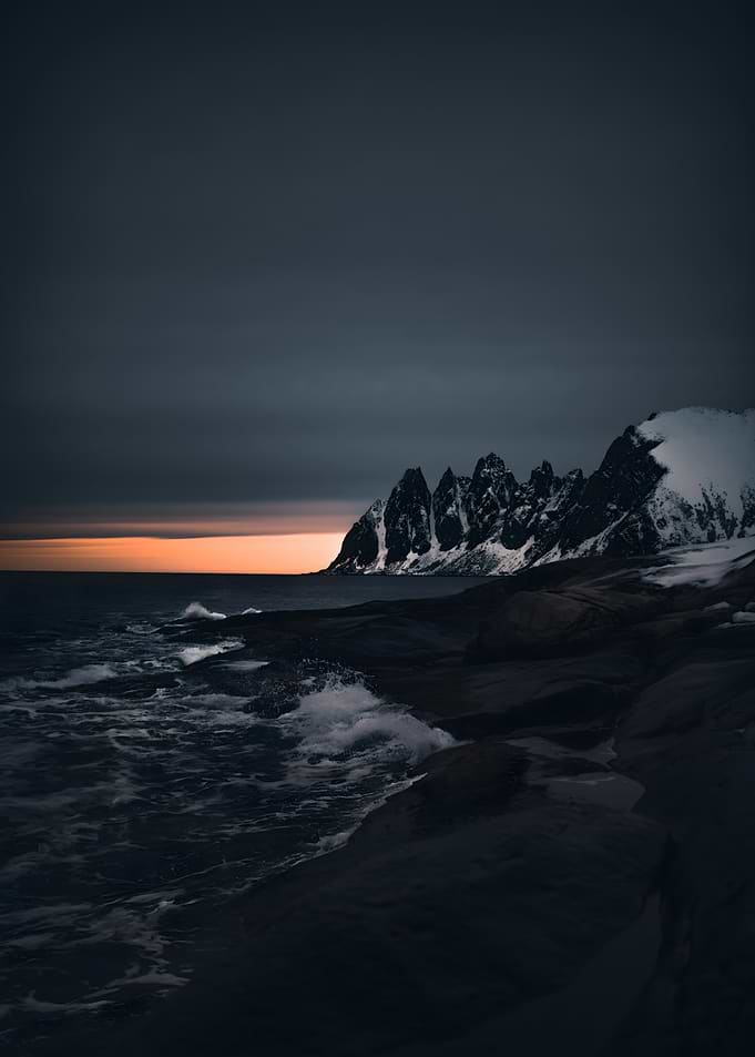 Dramatic Sunset Over Snowy Mountains