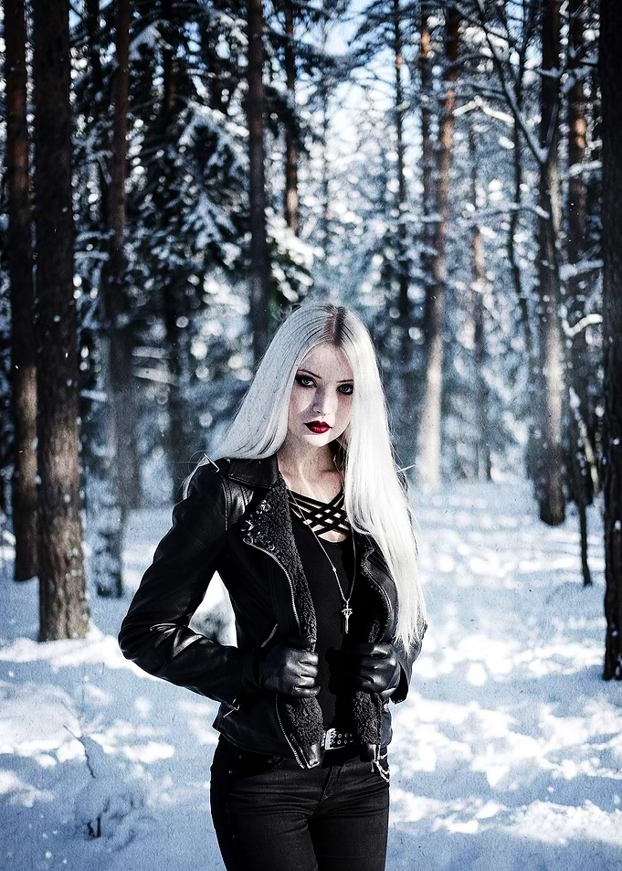 Gothic woman in snowy forest