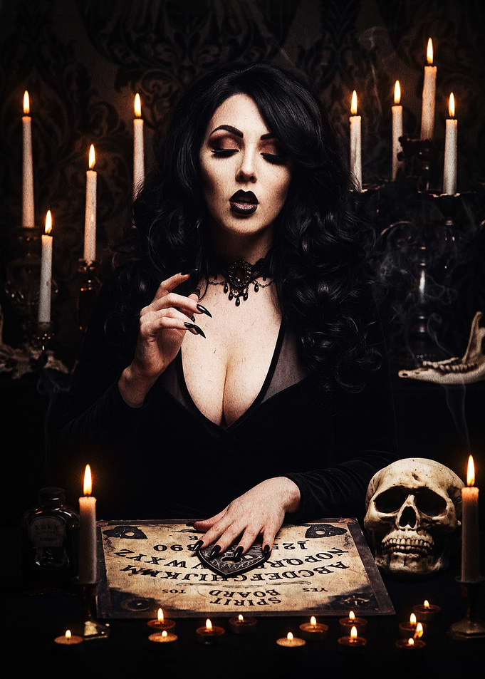 Gothic Woman Using Ouija Board