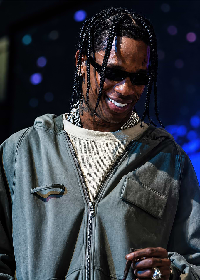 Travis Scott Smiling in Olive Hoodie
