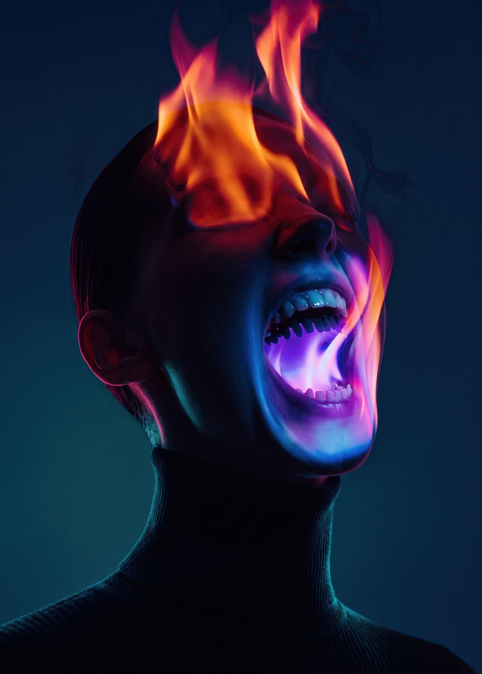 Person with Flaming Mouth and Eyes
