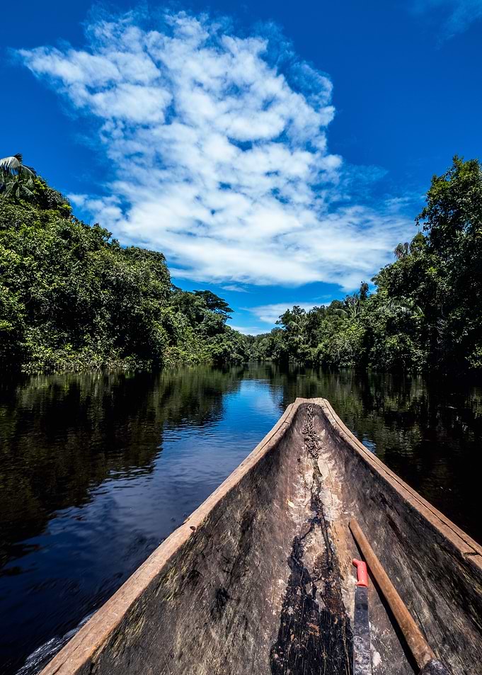 Canoe Journey Through Tropical River