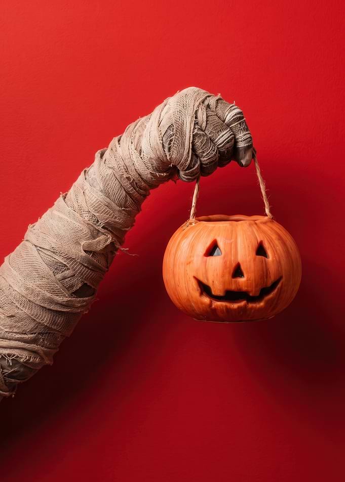 Mummy Hand Holding Halloween Pumpkin Bucket