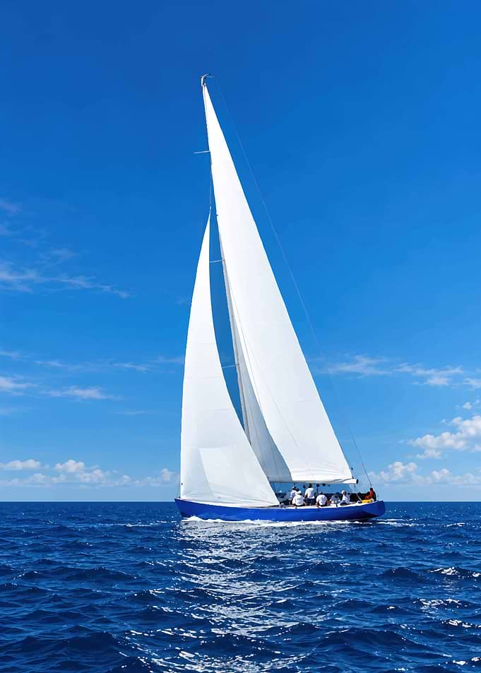 Blue Sailboat Sailing on Open Ocean