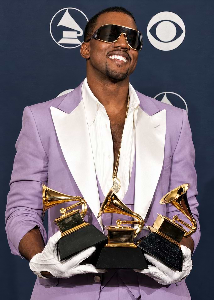 Kanye West Holding Three Grammy Awards
