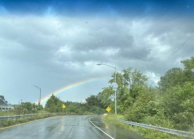 Rainbow over a wet road