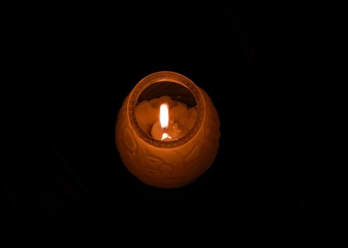 Glowing Candle in Decorative Holder