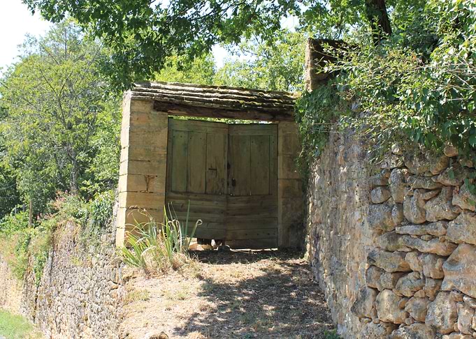 Rustic Stone Wall and Wooden Gate