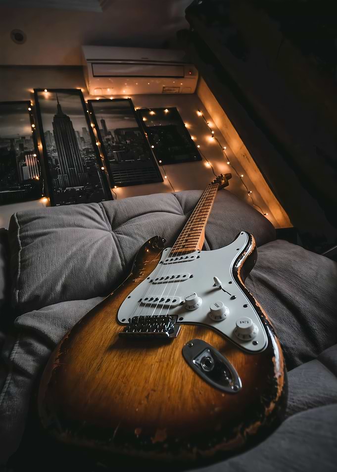 Vintage Electric Guitar on Sofa