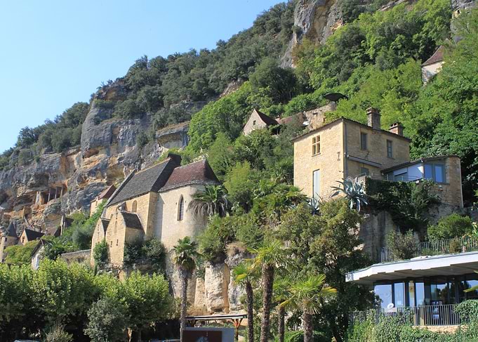 Historic Stone Buildings Built Into Cliffside
