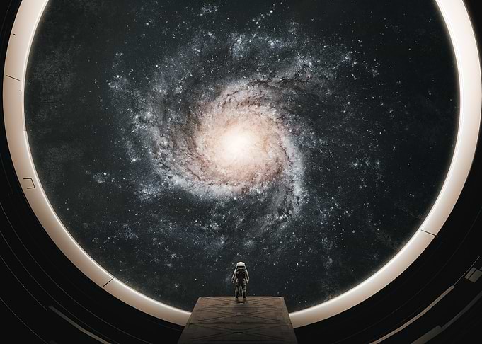 Astronaut Observing a Spiral Galaxy