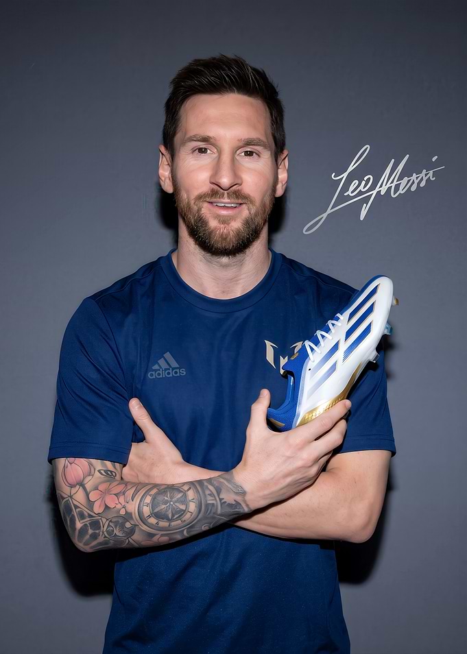 Lionel Messi Holding Signature Soccer Cleat