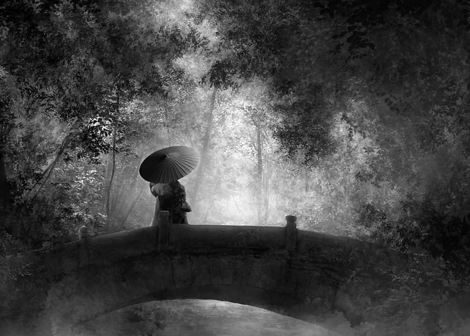 Woman with Umbrella on Stone Bridge