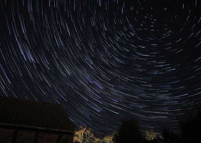 Star Trails Over Night Landscape