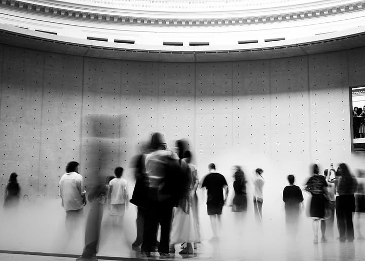 Blurred Figures in Modern Museum Hall