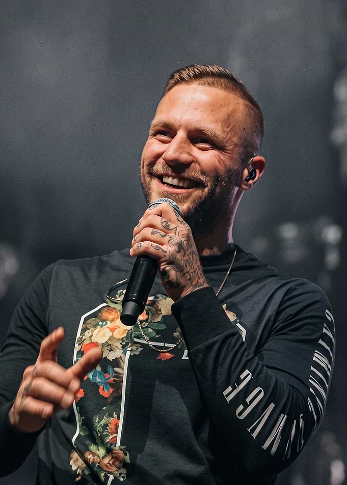 Smiling Musician Performing on Stage