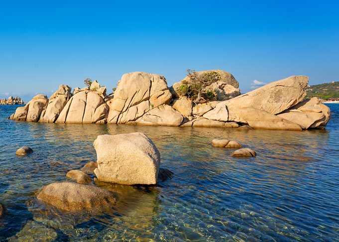 Rocky Island in Clear Blue Water