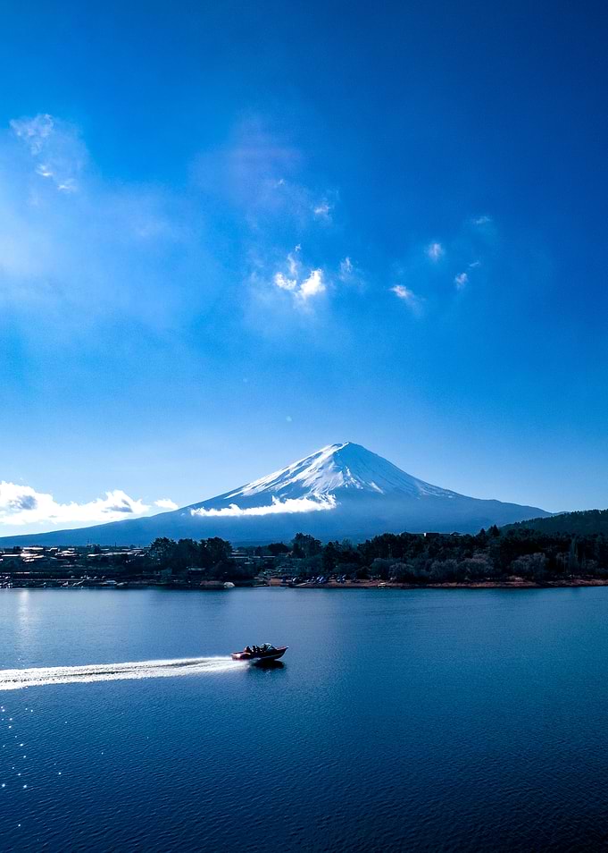 Motorboat on Lake Kawaguchi with Mount Fuji