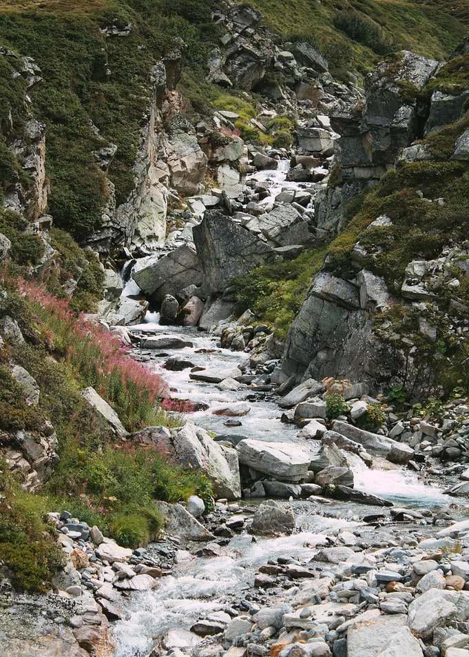 Mountain Stream Through Rocky Valley