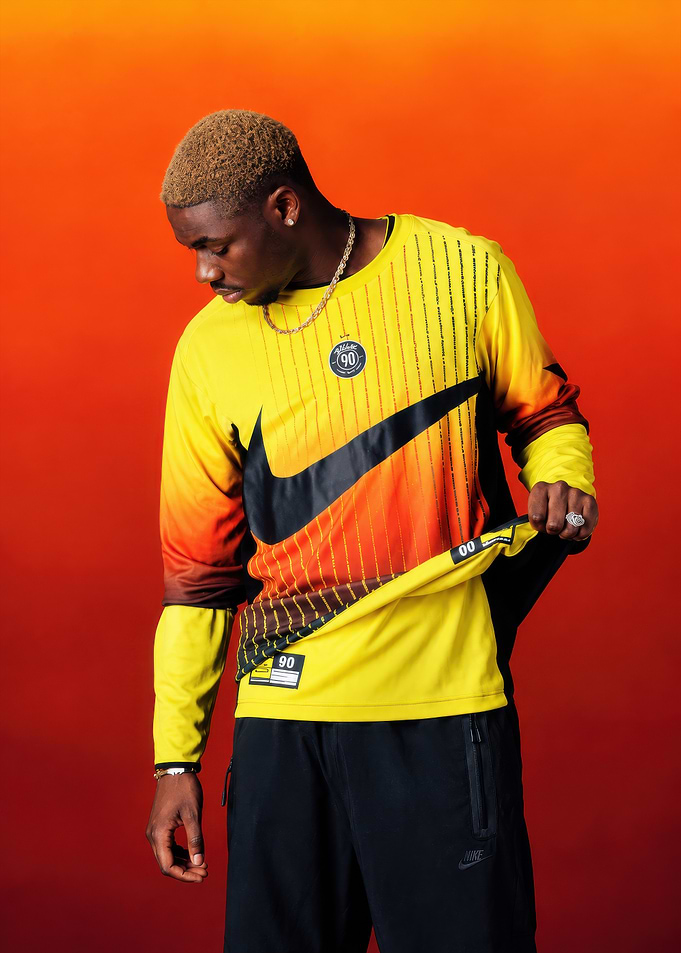 Tiakola wearing Nike Total 90 jersey