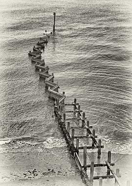 Black and white groins on the Suffolk coast.