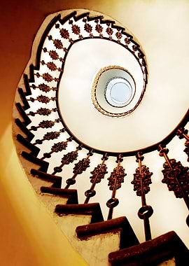 Spiral staircase in yellow and orange tones