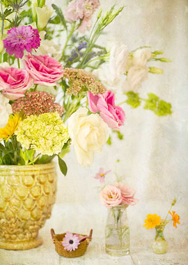 Still life of assorted flowers in different vases and b ...