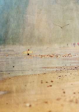 Lone surfer emerges from the Pacific Ocean in Huntingto ...