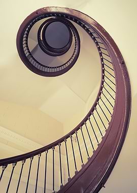 Wooden spiral staircase in pastel tones