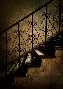 Old staircase with ornamented handrail
