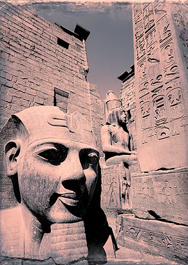 the gateway to Luxor temple Egypt with colossi of Ramse ...
